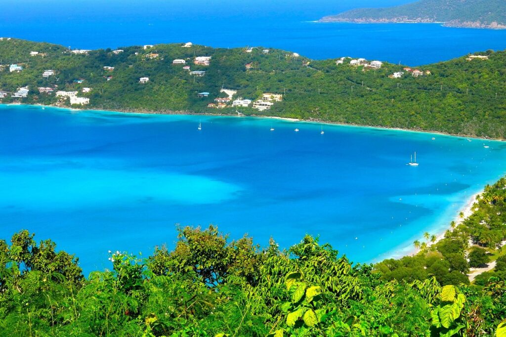 Aerial view of Magens Bay with turquoise water and lush green hills in St. Thomas, US Virgin Islands